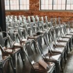 a room filled with lots of metal chairs